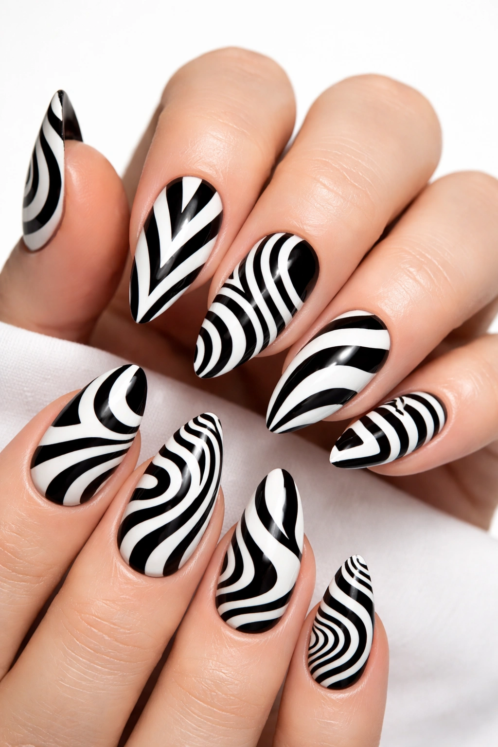 Close-up black and white op art nail with bold lines