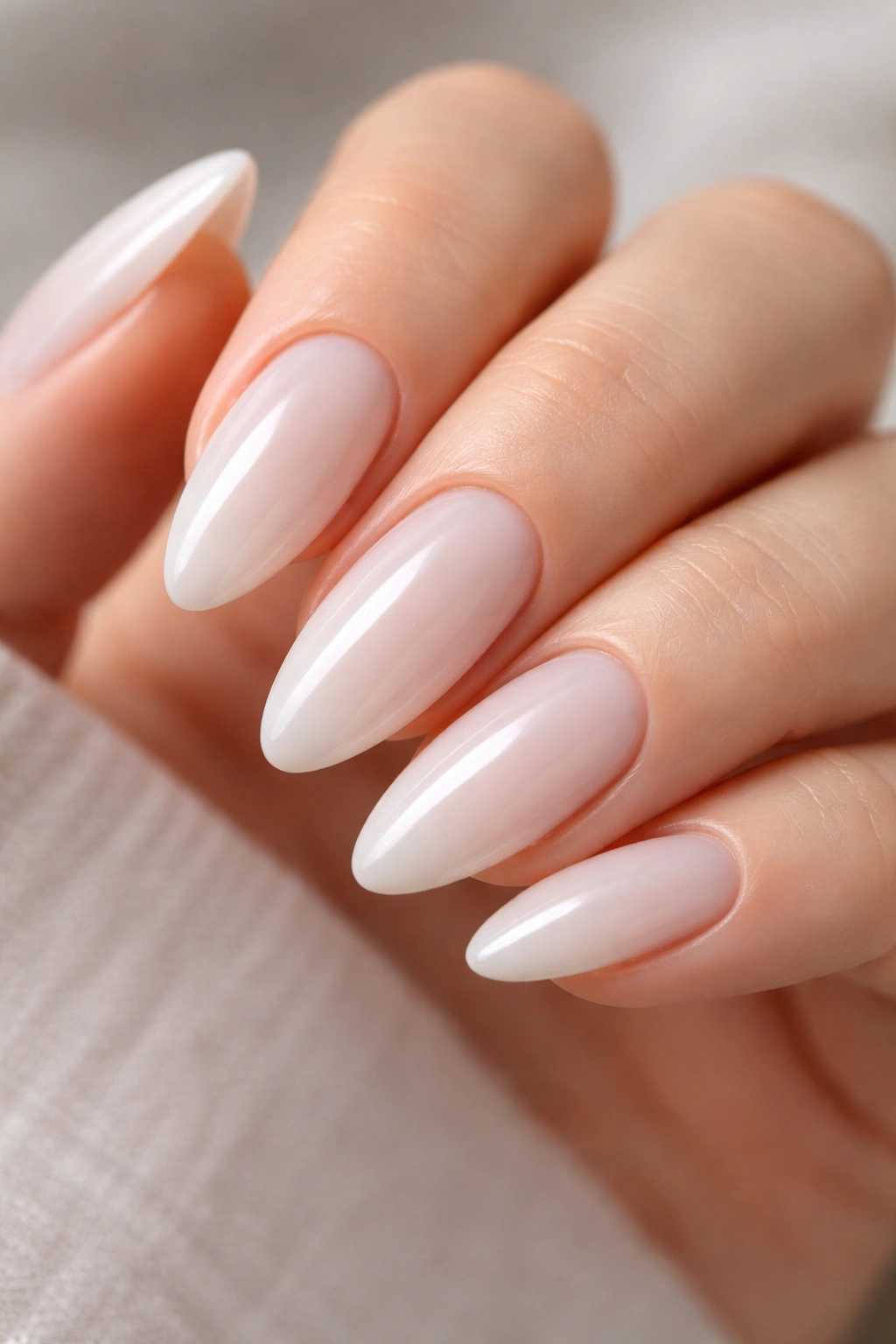 Almond nails with opaque milky jelly finish and subtle translucency