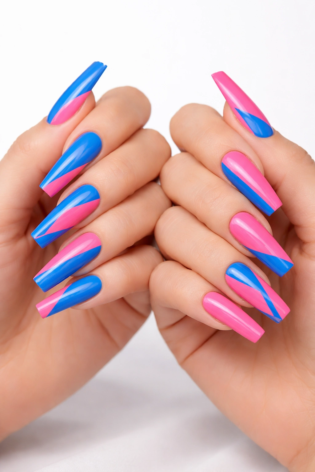 Close-up of long coffin nails showing blue-pink opposite color blocking on two hands