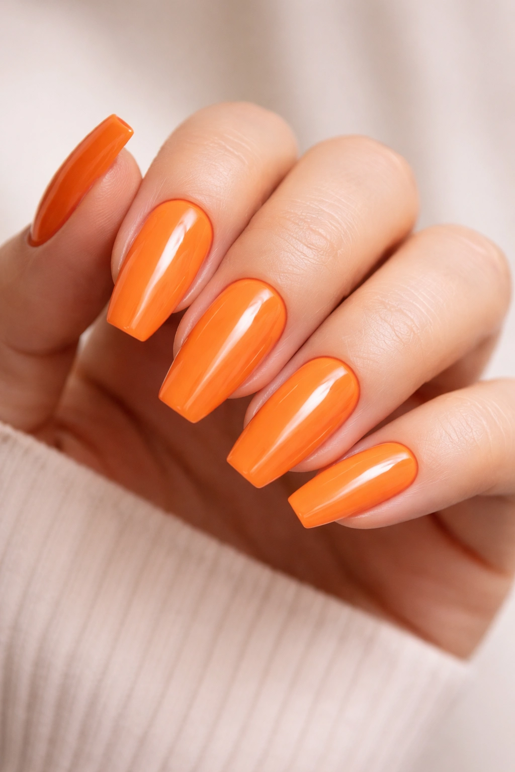 Full set of glossy tangerine ballerina nails