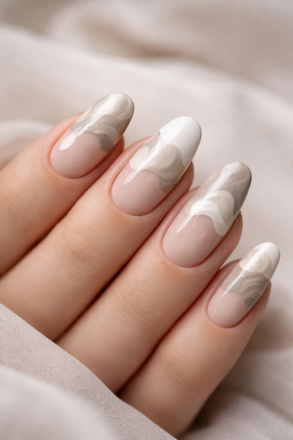 Nails featuring freeform organic tip shapes with soft edges and layered colors