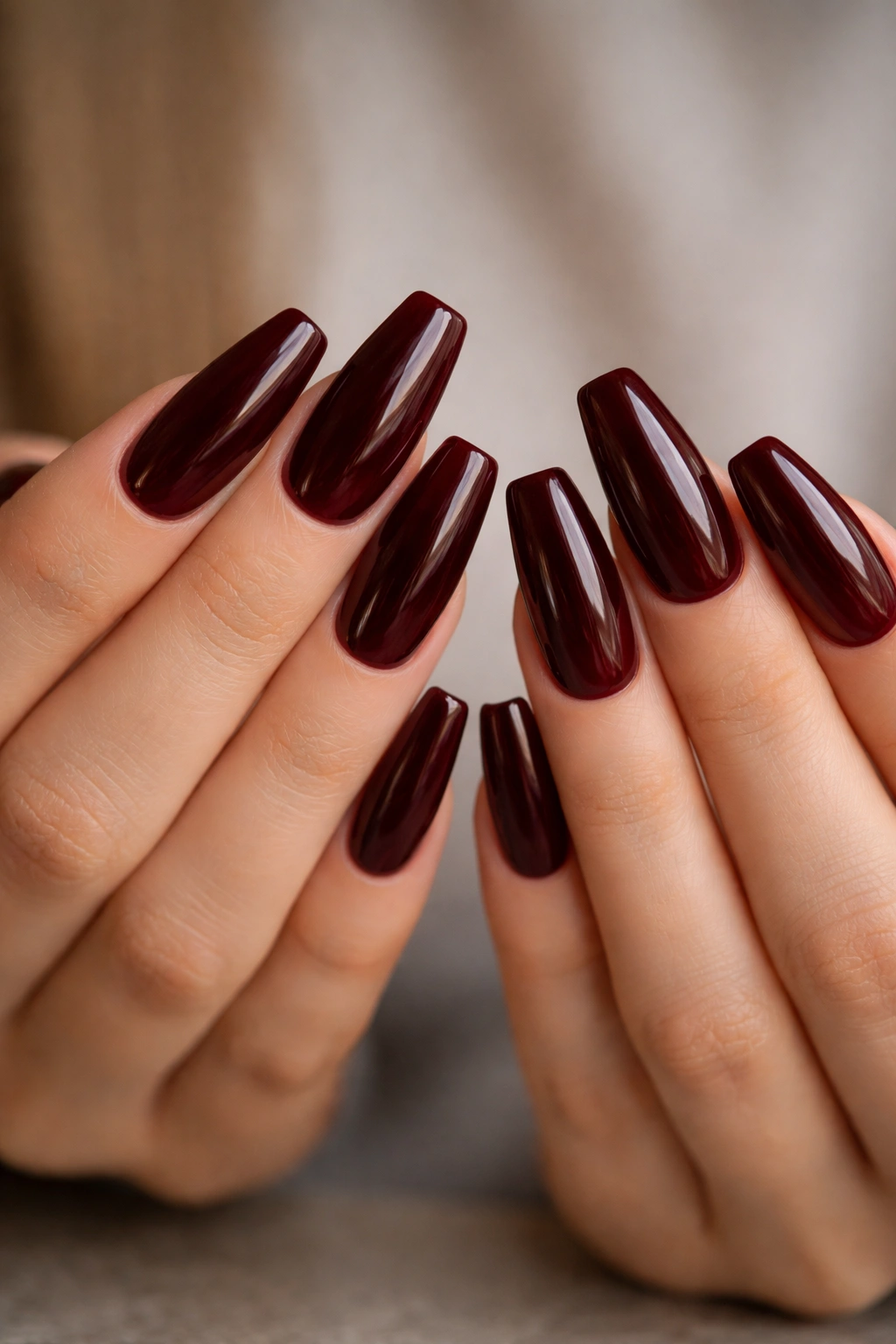 Glossy oxblood full set on medium-length ballerina nails