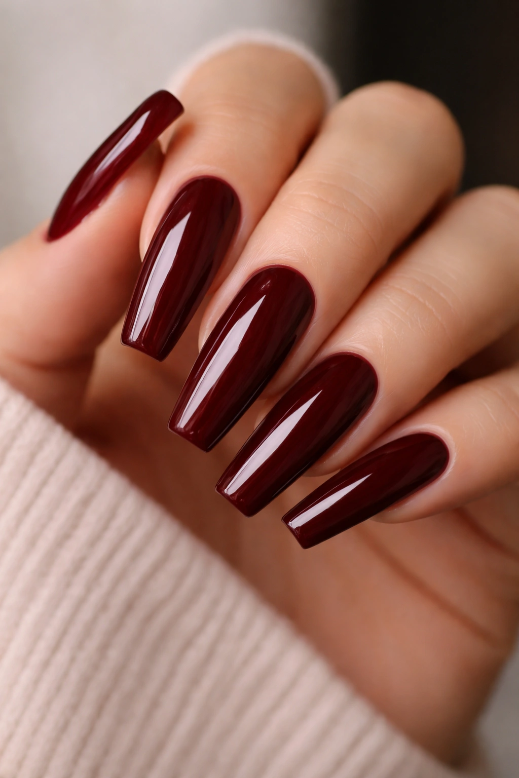 Glossy oxblood ballerina nails with high shine