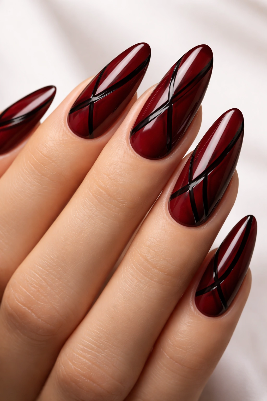Oxblood red nails with black negative space lines