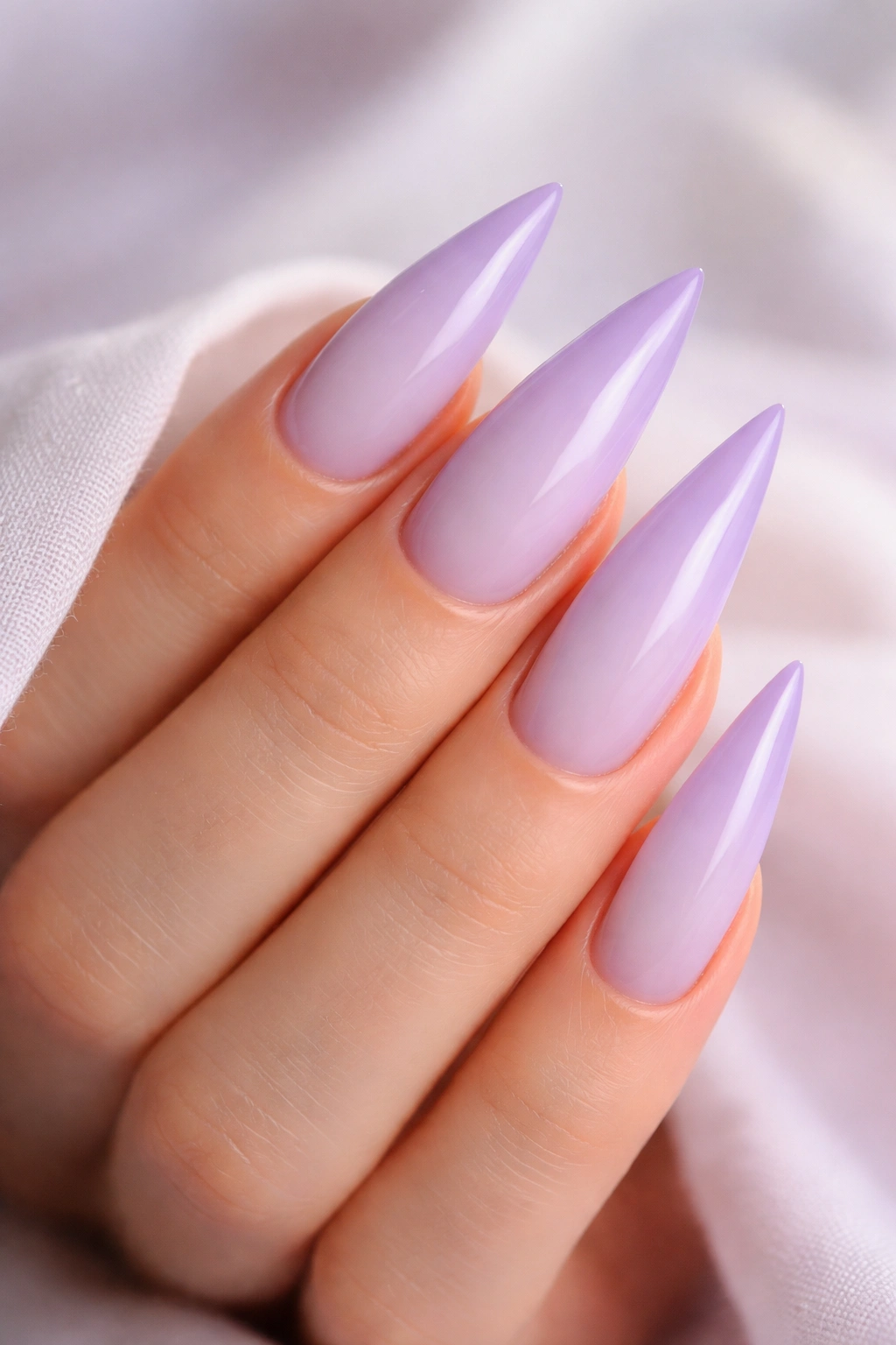 Close-up of pale lavender nails with gradient