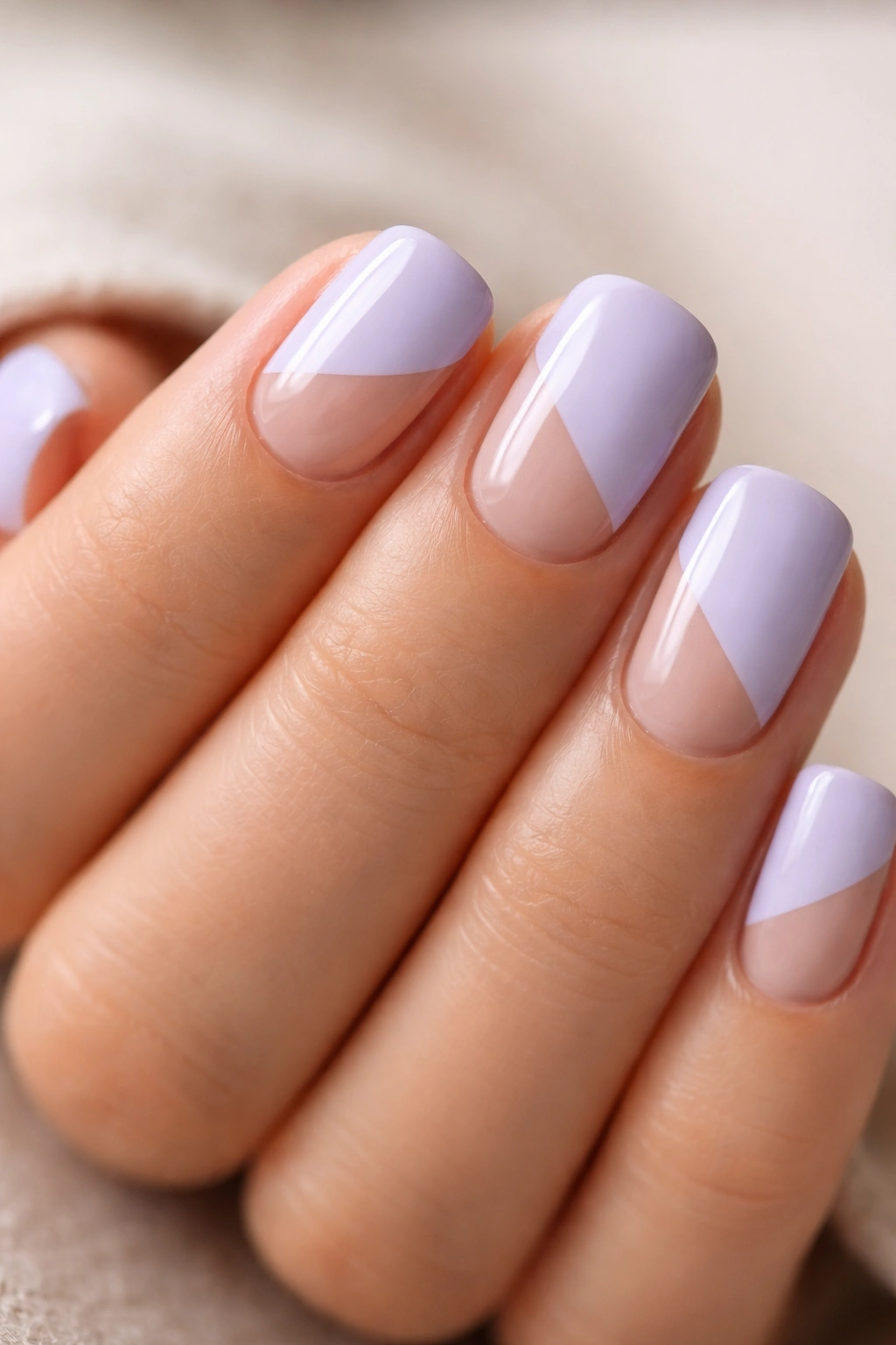 Pale lavender nails with negative-space geometric shapes