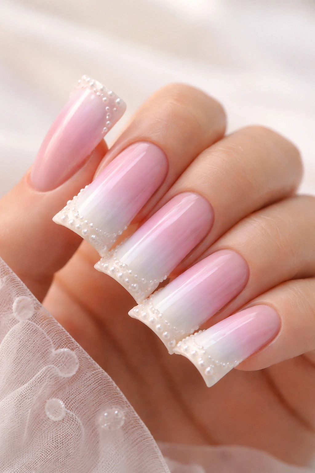 Duck nails with pastel ombre gradient and pearl accents on tips
