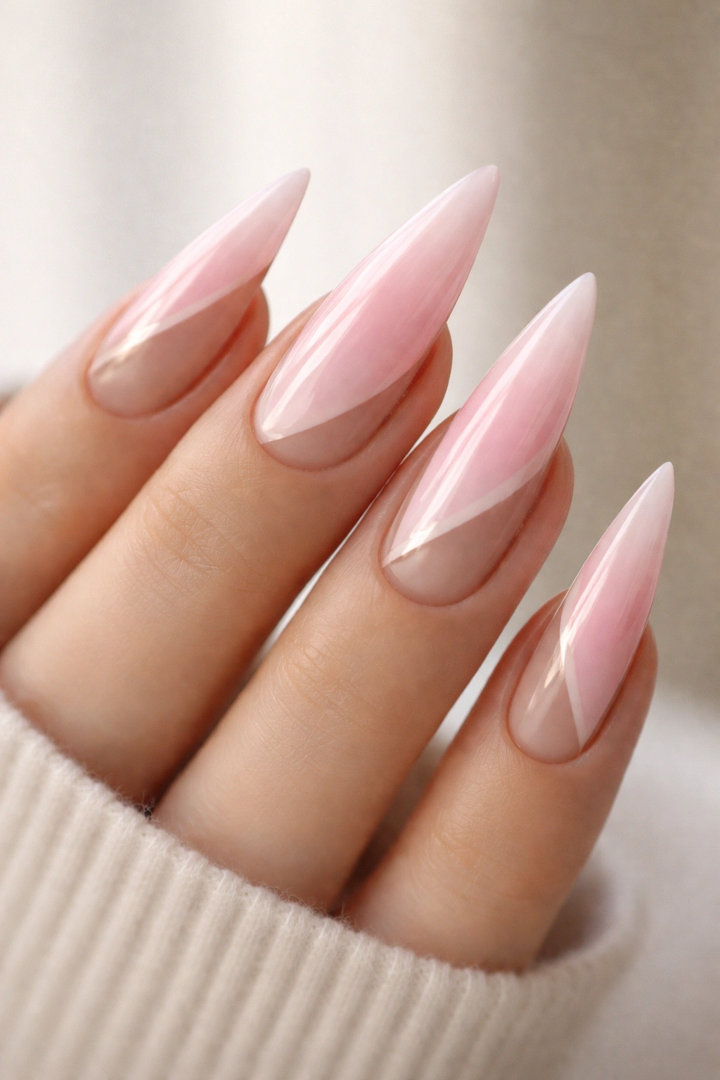 Pastel pink ombré stiletto nails with negative space geometric design