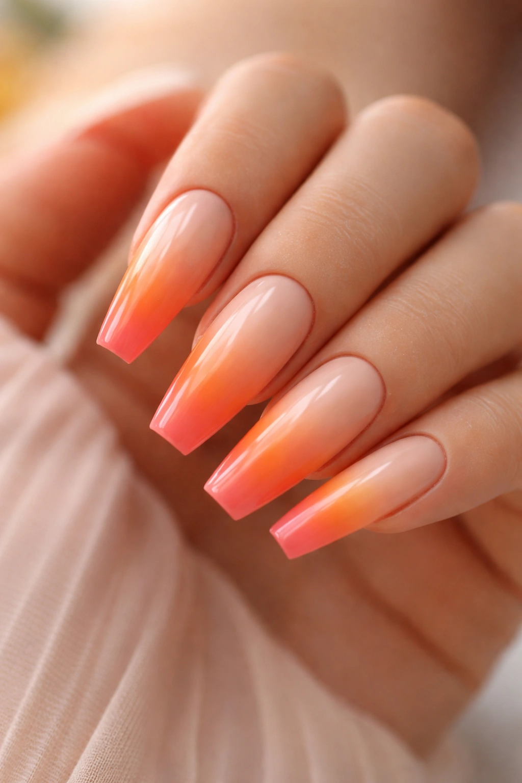 Pale peach coffin nail with sunset gradient