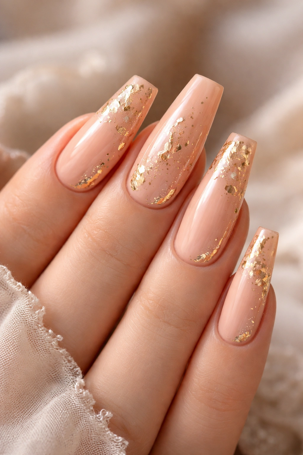 Peachy nude coffin nails with gold foil texture