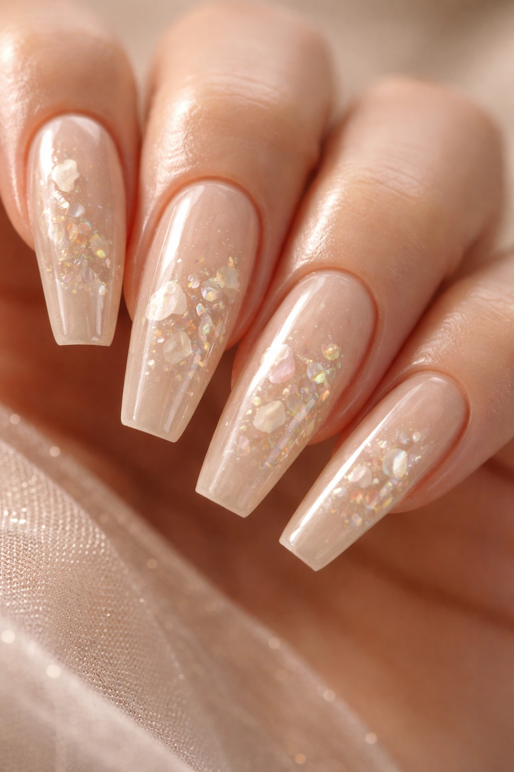 Pearl beige nails with crushed shell shine and encapsulated shells