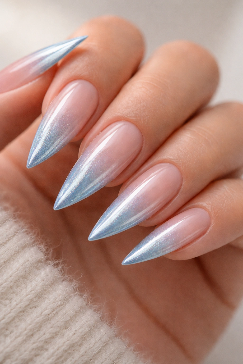 Pearl blue French tip nails with subtle shimmer on stiletto shape