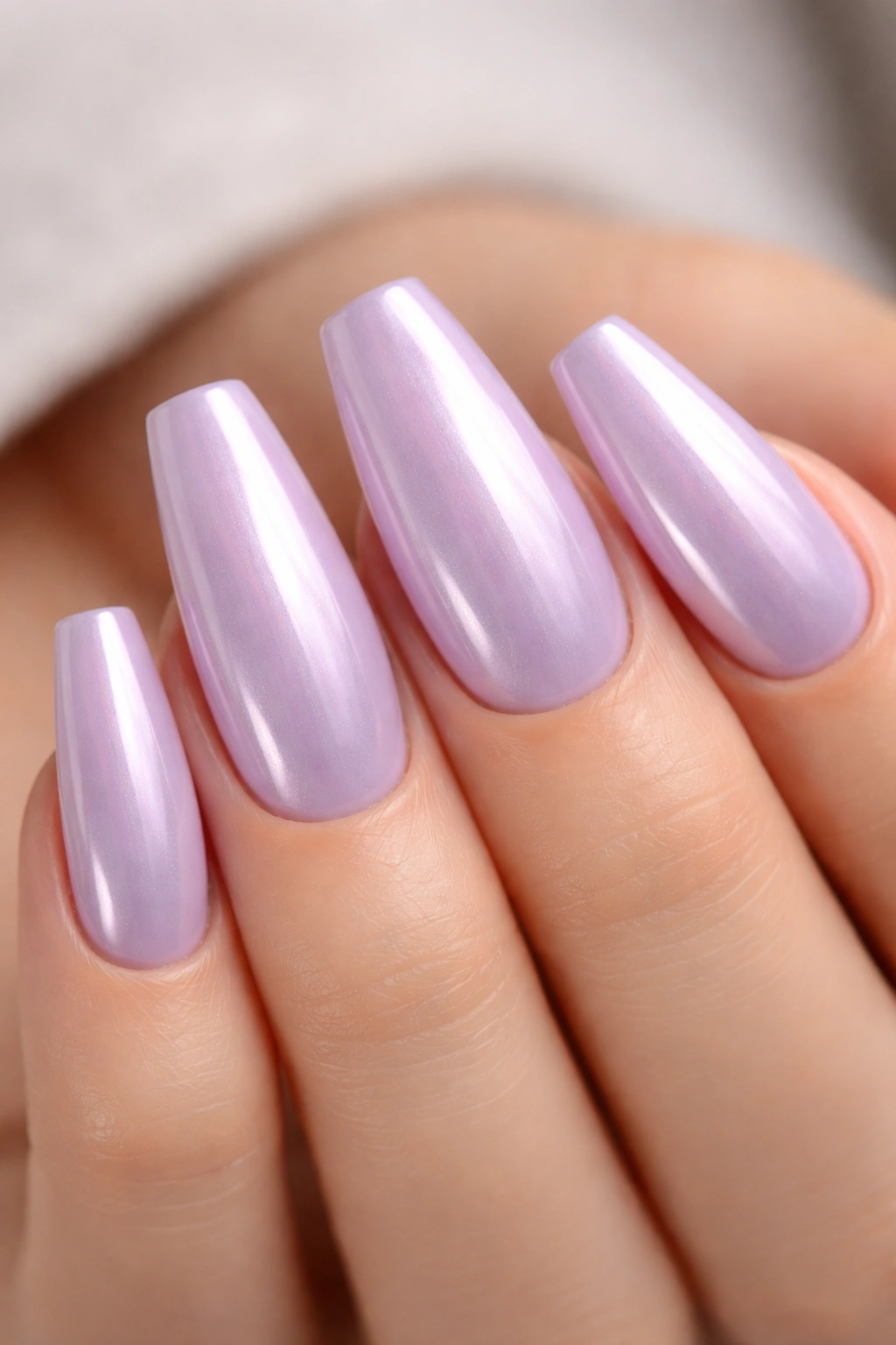 Pearl-glazed lilac chrome on ballerina nails with subtle glow