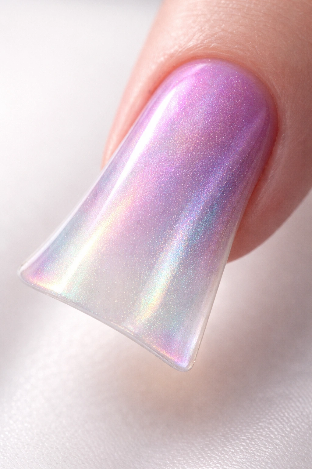 Close-up of a duck nail with pearlescent shimmer fade on pale base
