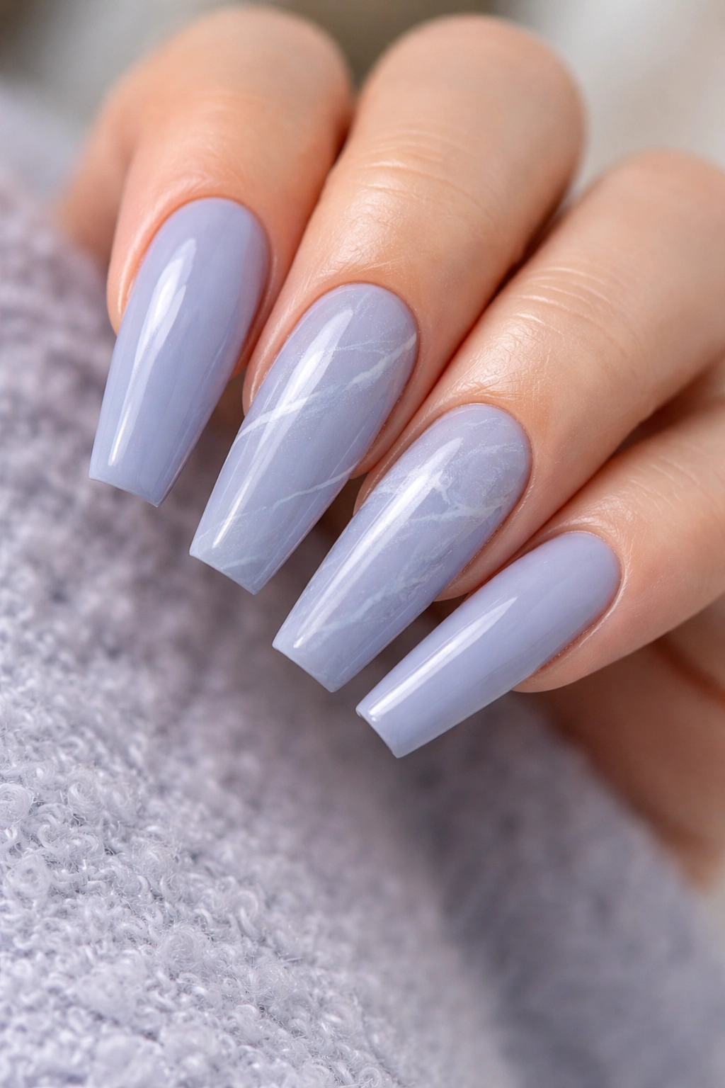 Periwinkle marble nails with soft white veining on ballerina shape
