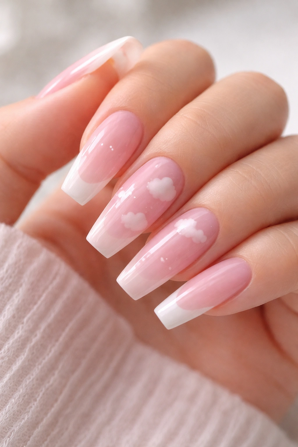 Pink jelly nails with tiny white cloud details on accent nails
