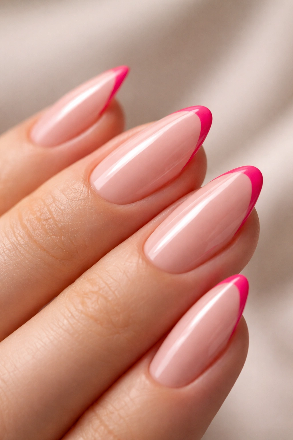 Short almond nail with a thin hot pink line and negative space