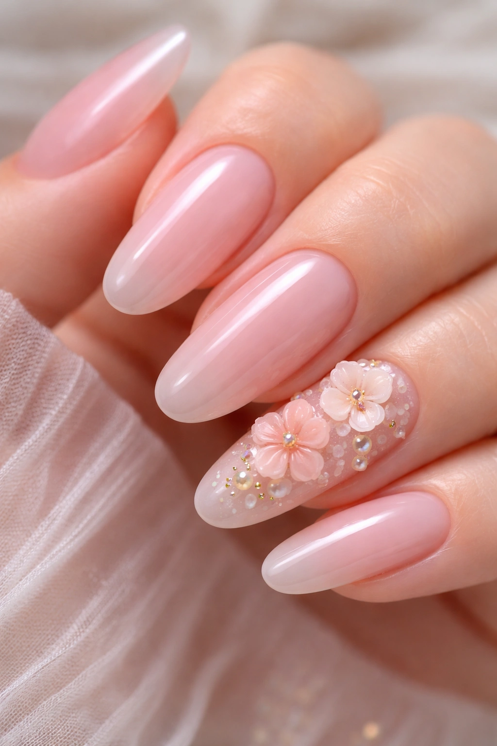 Sheer pink nails with 3D gel flower accents on the accent nail