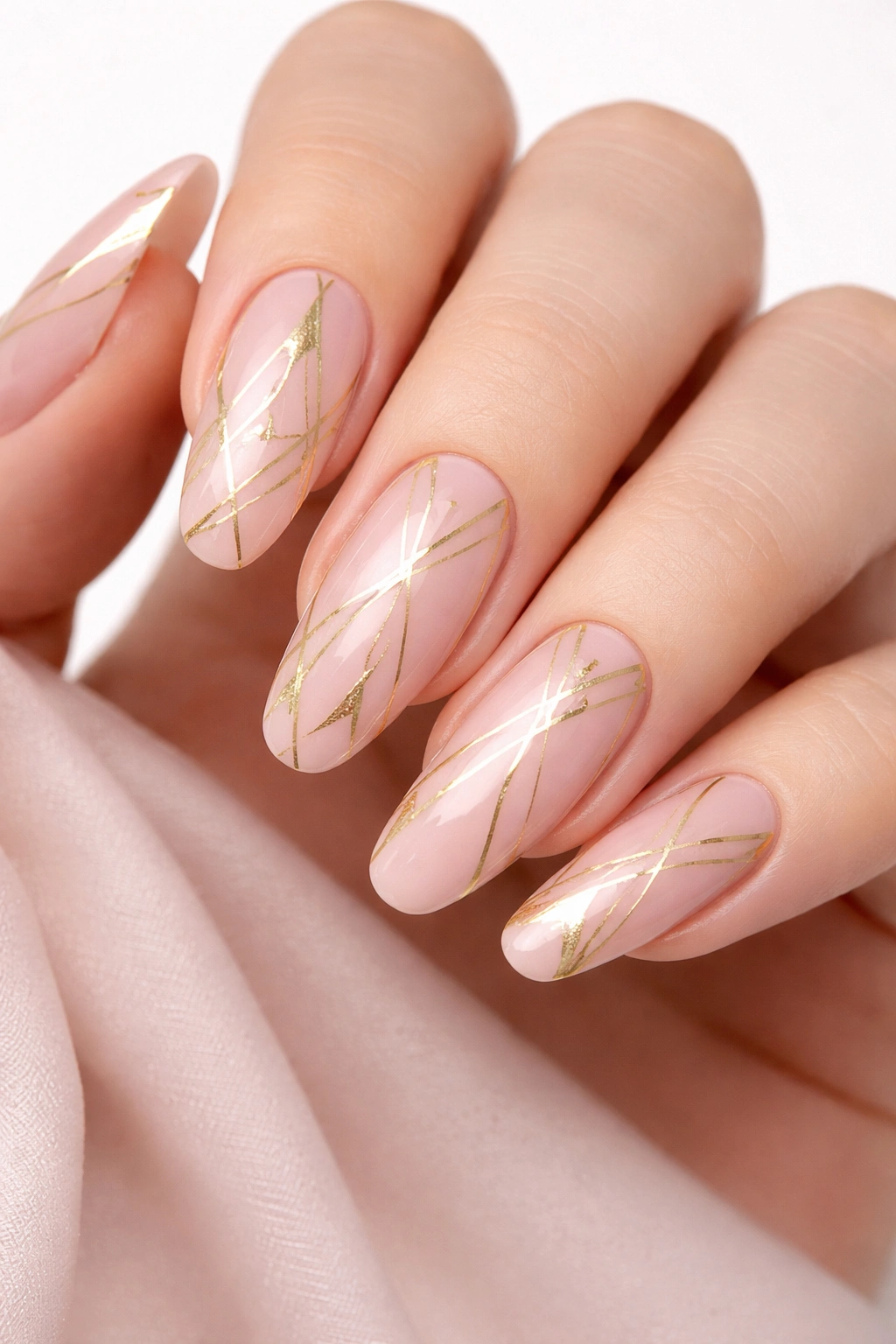 Pink nails with gold geometric patterns