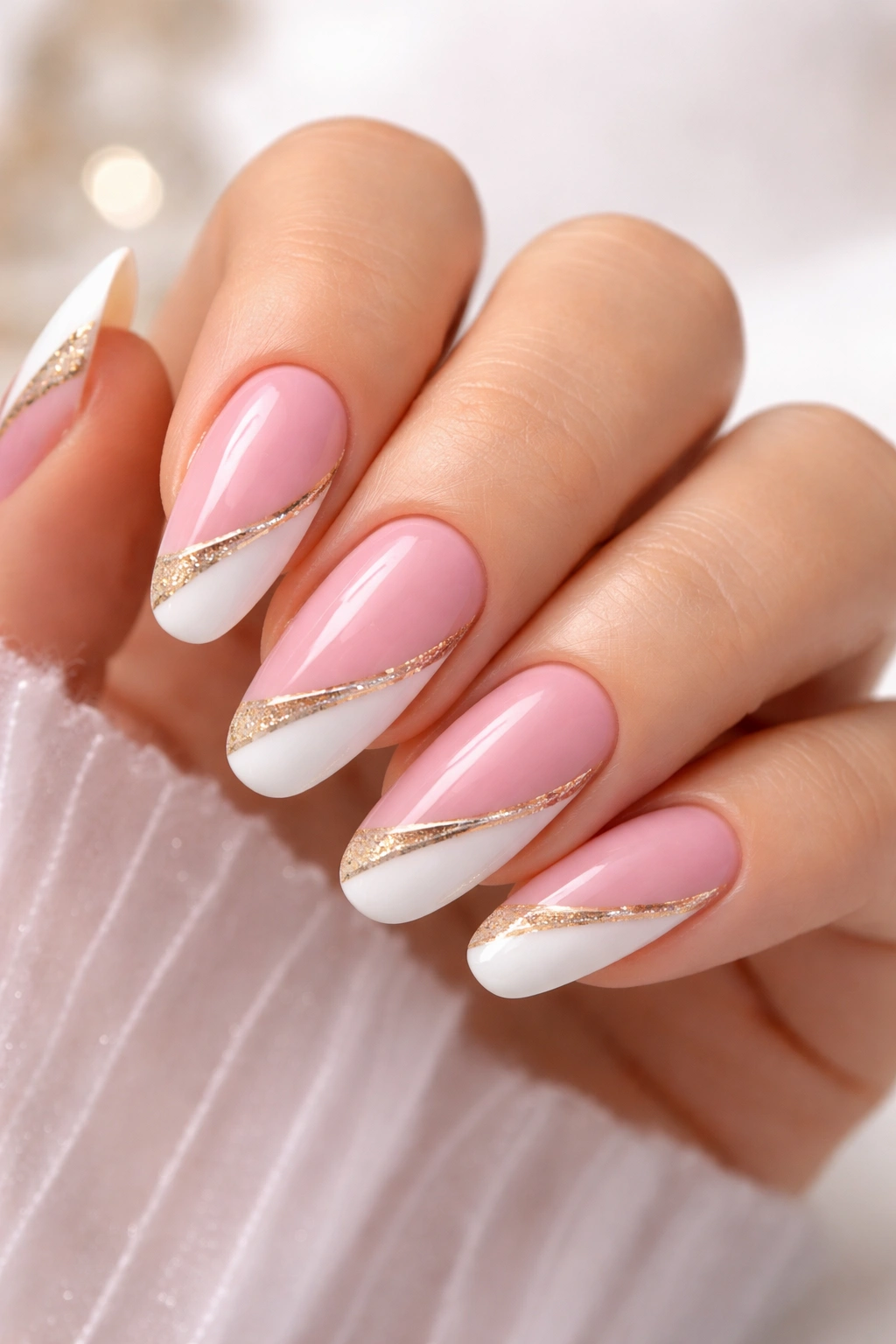 Nails with pink base featuring white and gold accents in a chic mix.