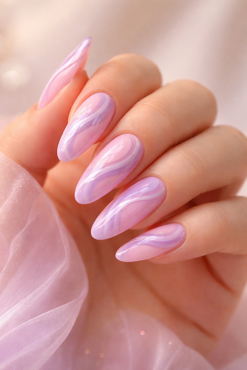 Close-up of pink and purple swirl nails with dreamy gradient