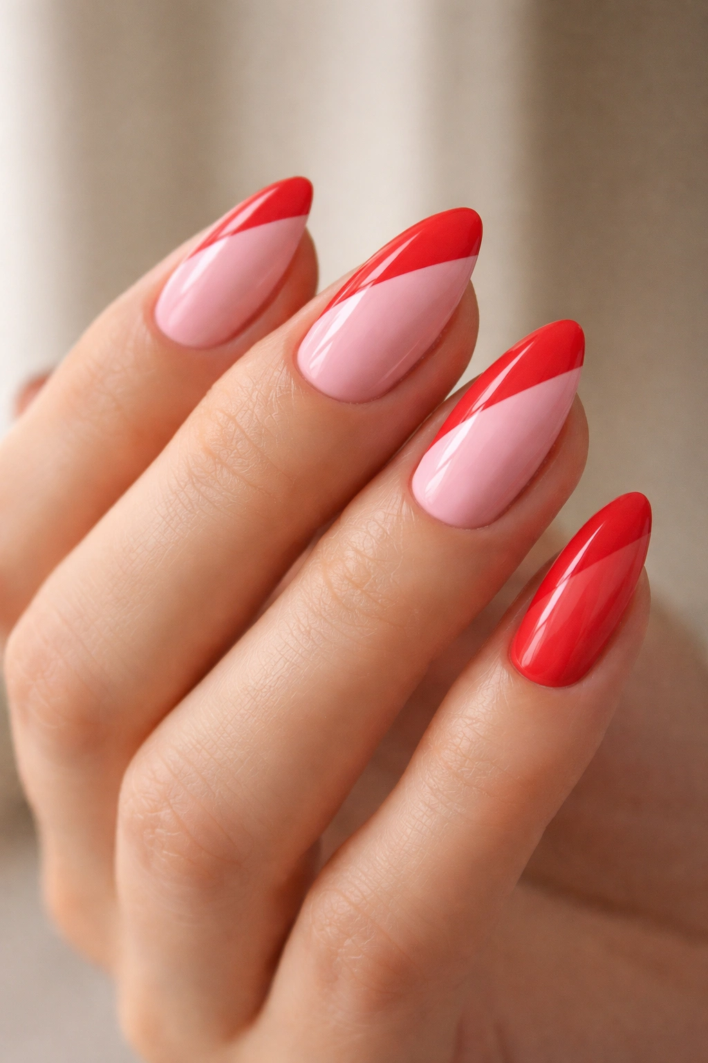 Almond nails with pink and red diagonal color block split design