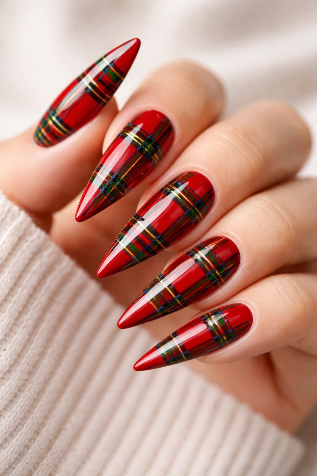 Stiletto nails in red base with green plaid lines