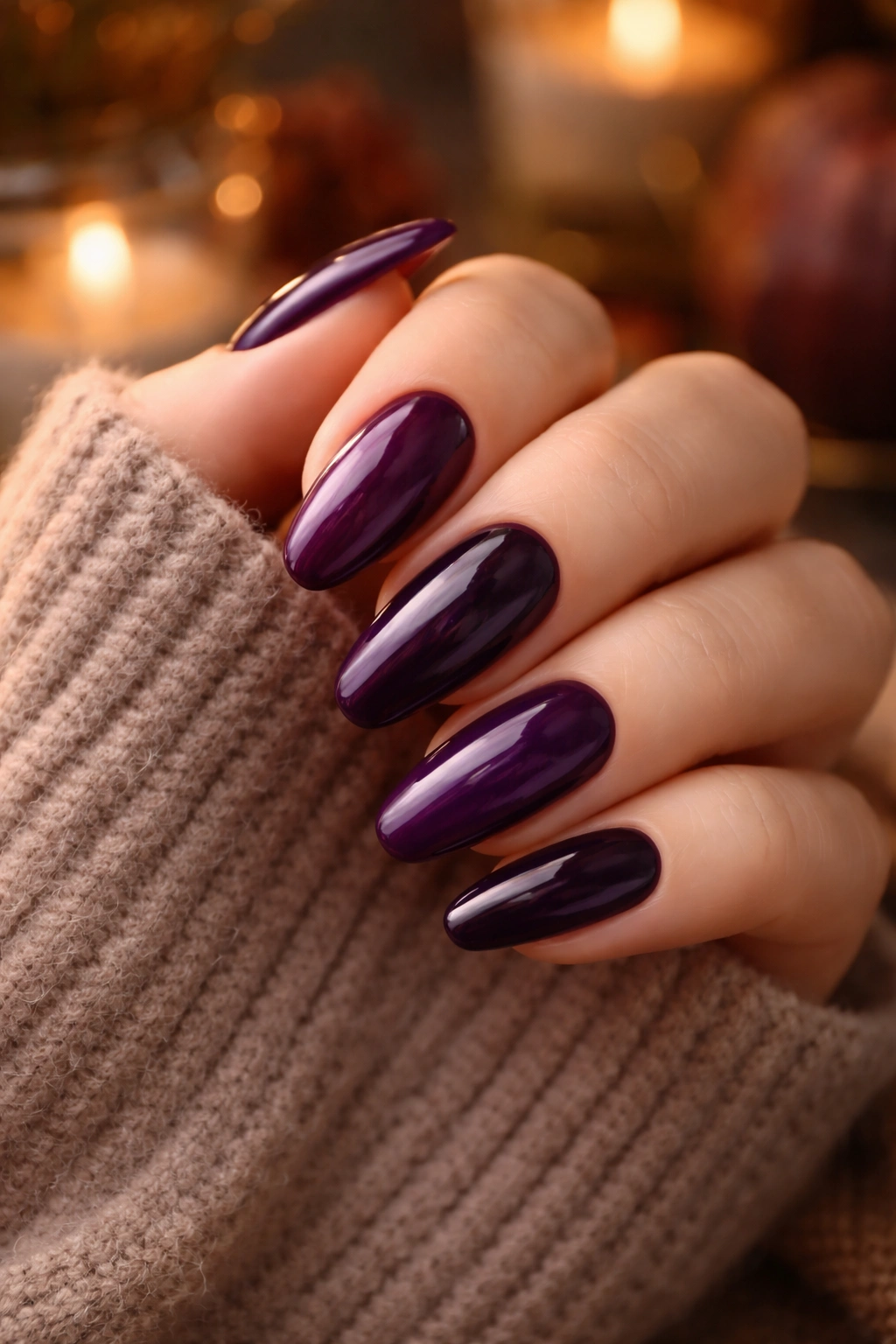 Close-up of plum and aubergine nails with rich fall color.