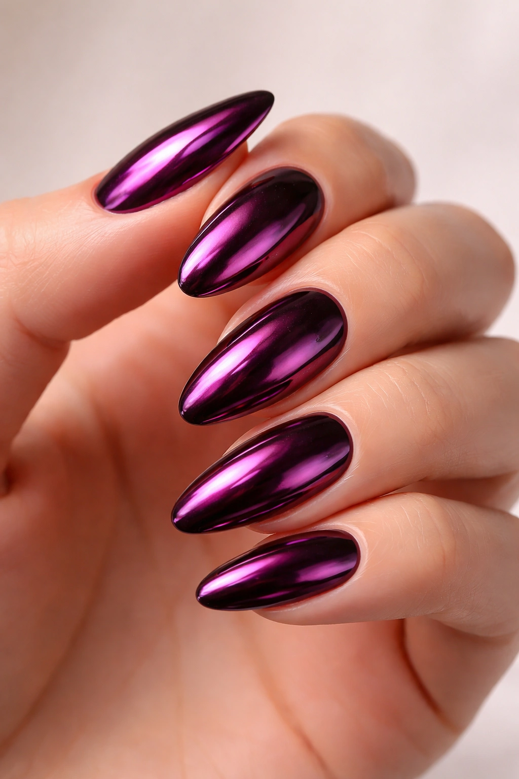 Close-up of plum chrome nails illustrating a cohesive final look