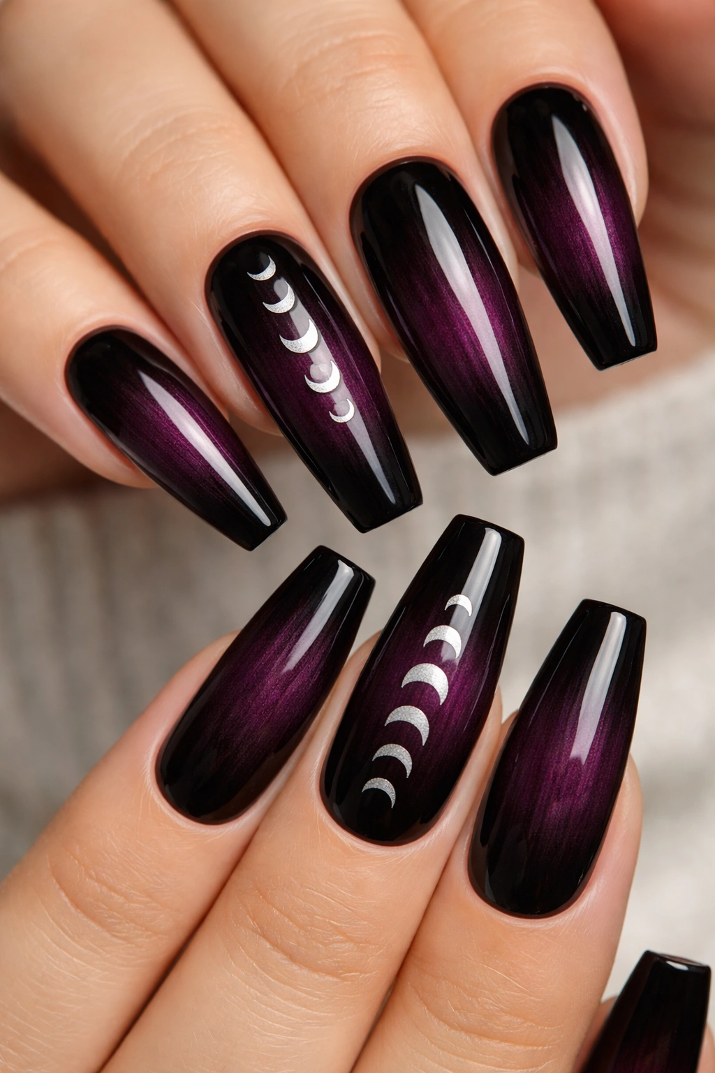 Plum to black gradient nails with tiny silver moon phase accents