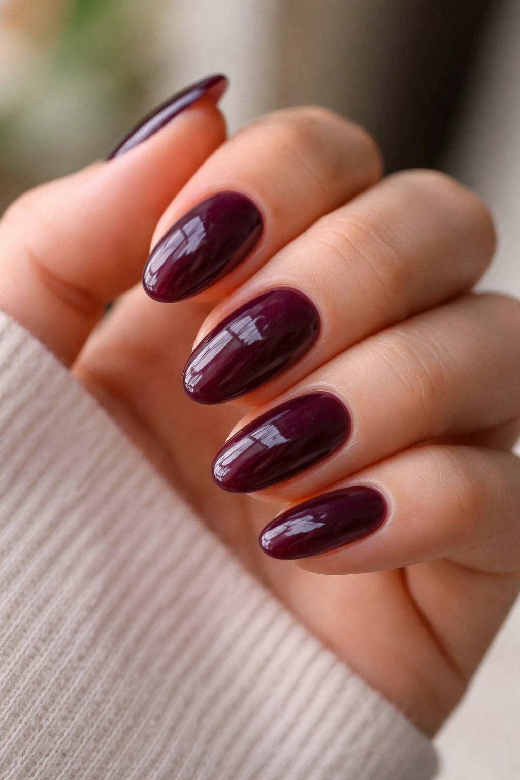 Close-up of plum jelly almond nails showing translucency