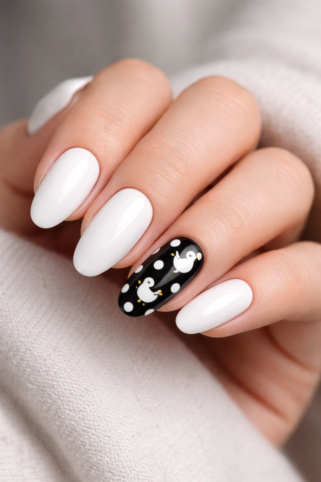 Polka dot duck accent nails on a monochrome manicure