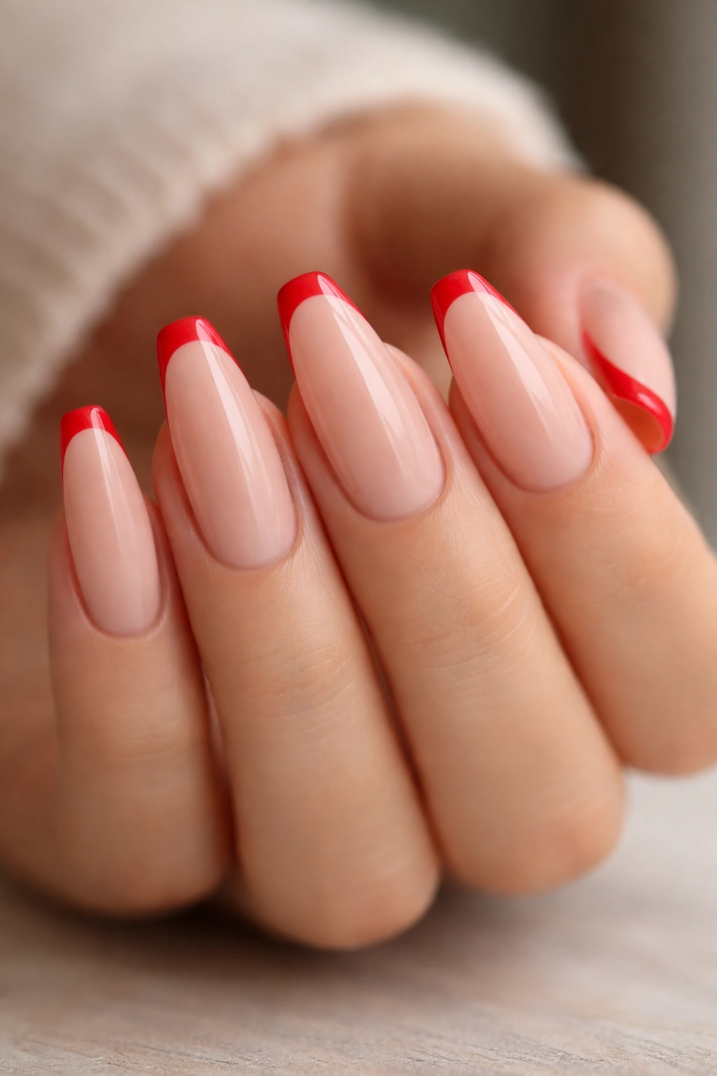 Nude base with red micro-French tip on ballerina nails