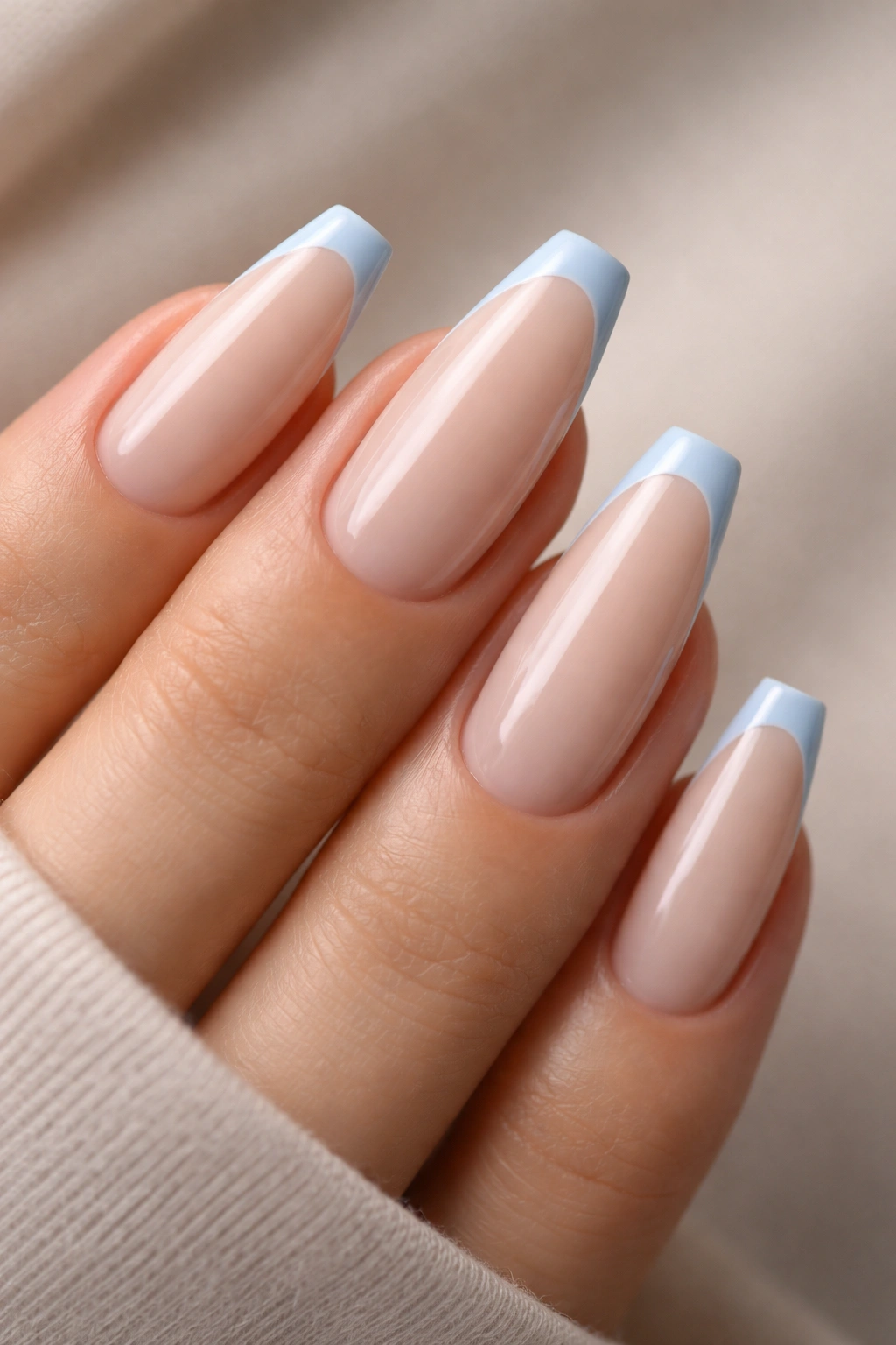 Powder blue micro tip on milky nude ballerina nails with a slim blue edge
