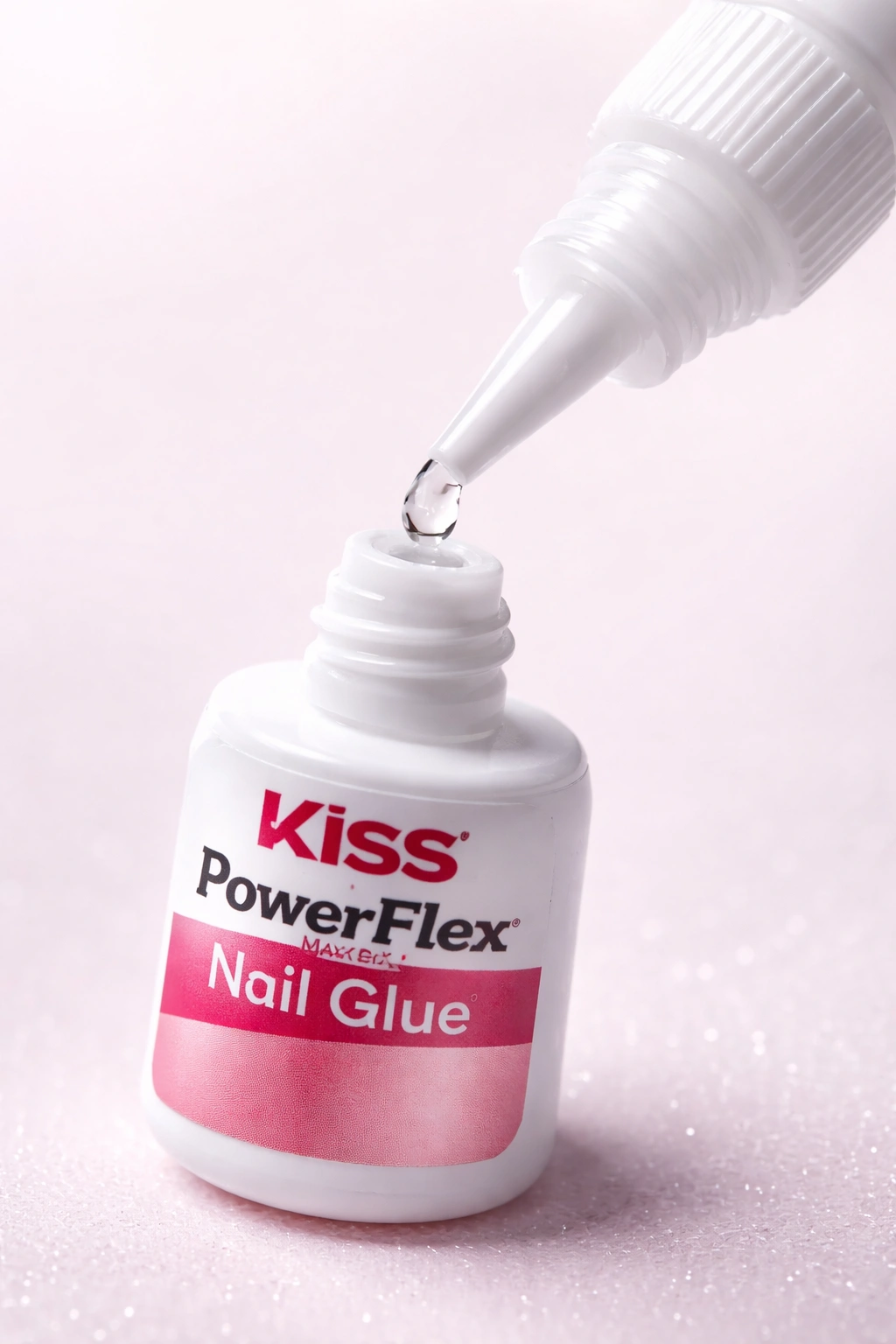 Slim nail glue bottle with fine nozzle and clear adhesive bead
