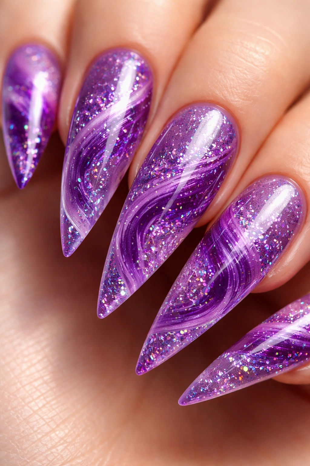 Close-up purple nails with encapsulated glitter swirl