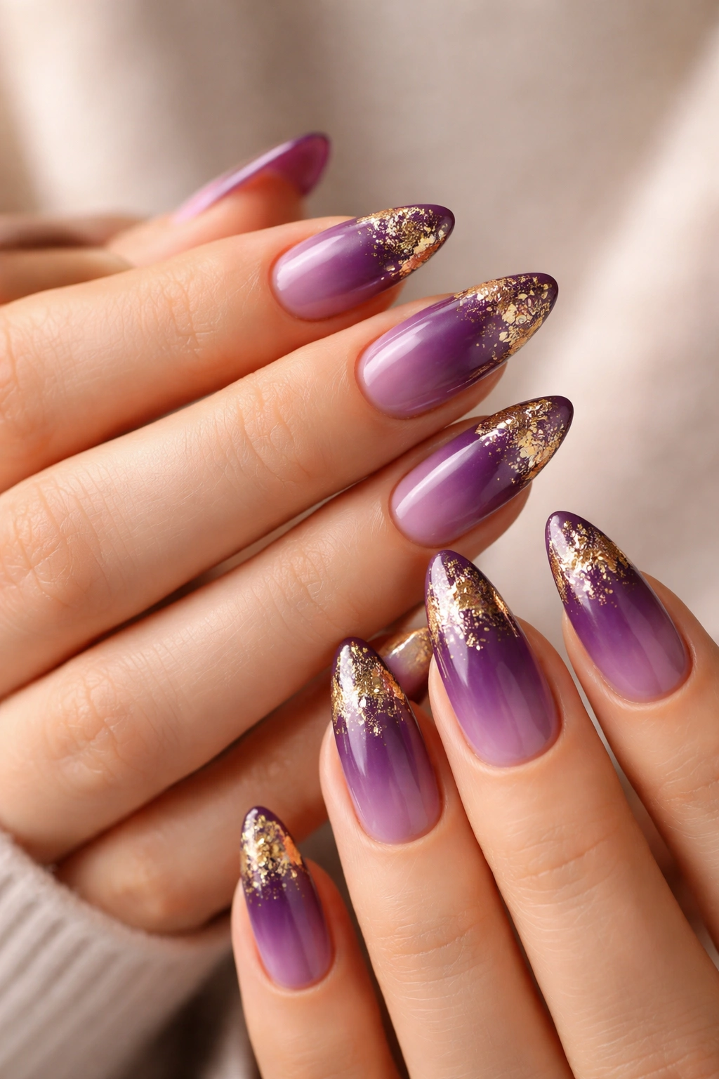Purple and gold foil almond nails with subtle foil accents