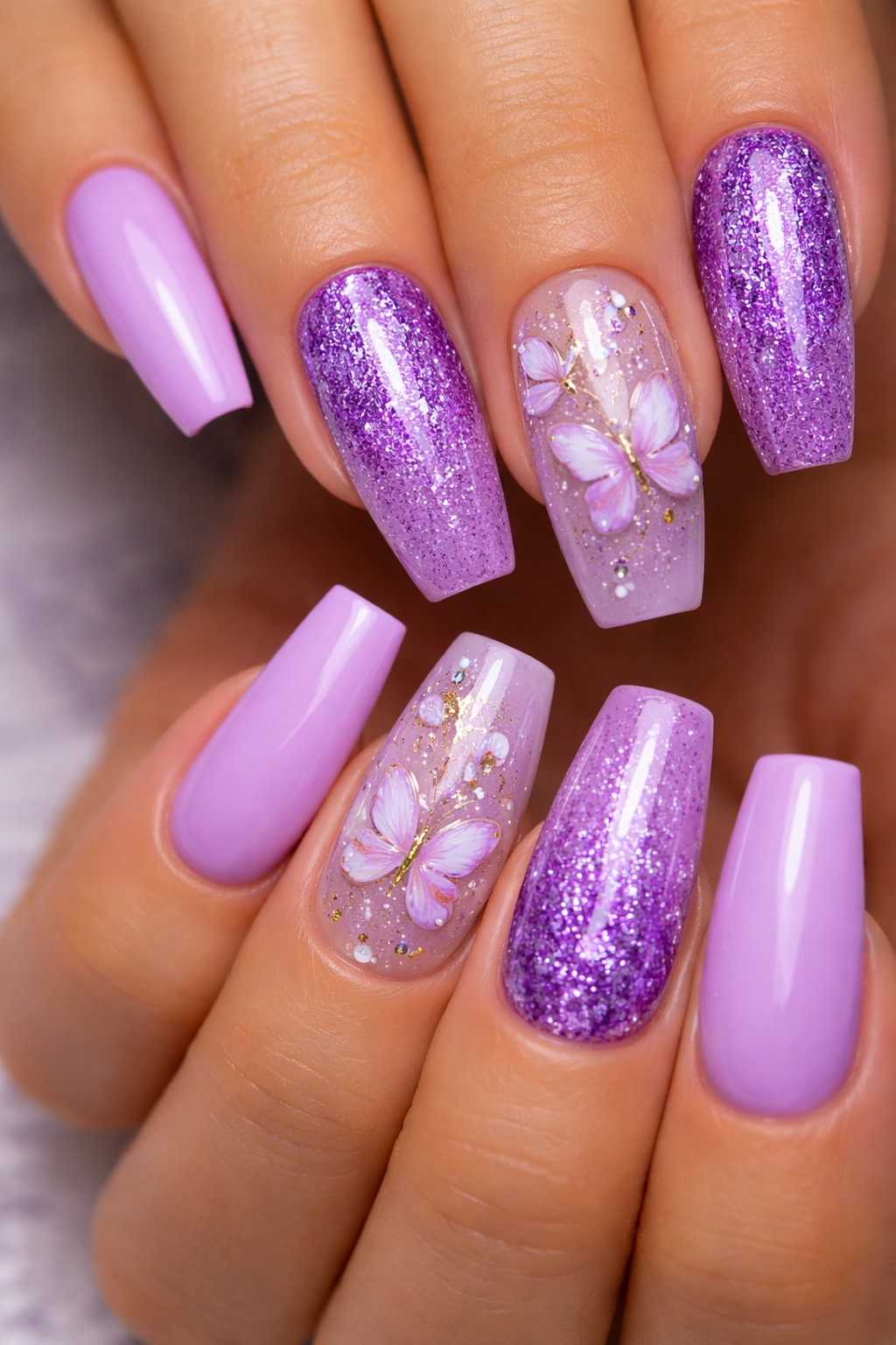 Purple nails with butterfly accents on accent nails