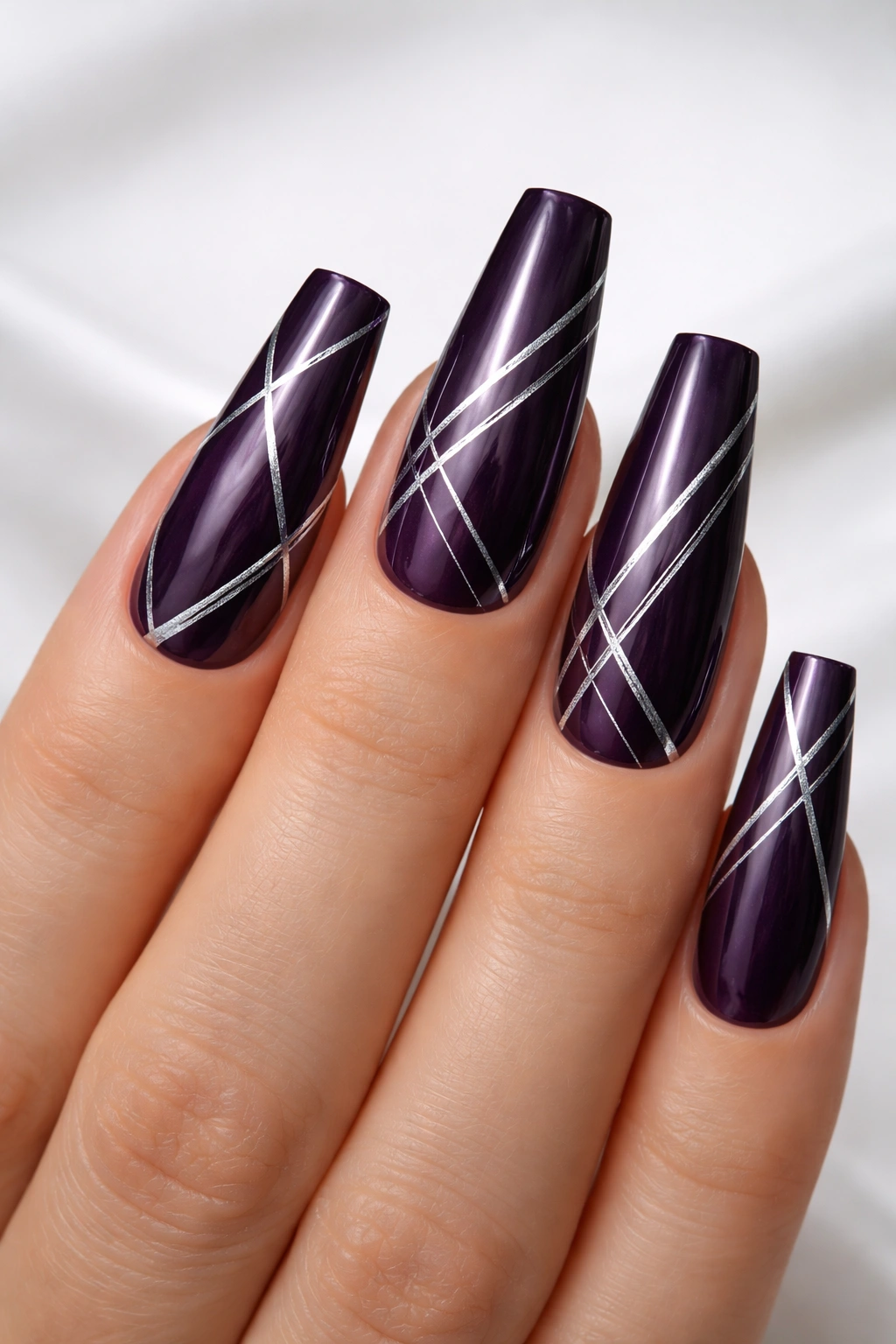 Coffin nails with dark purple base and silver foil geometric lines