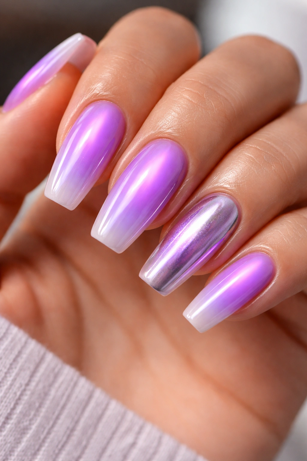 Close-up of neon purple aura on ballerina nails with soft fade to lavender
