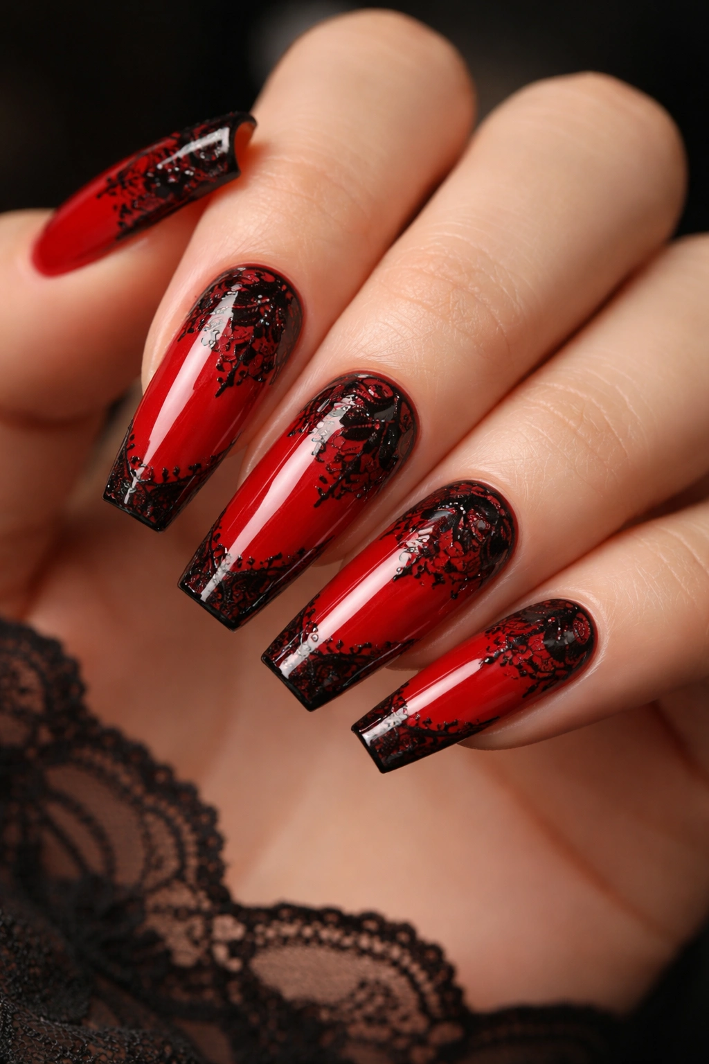 Glossy red coffin nails with black lace detail