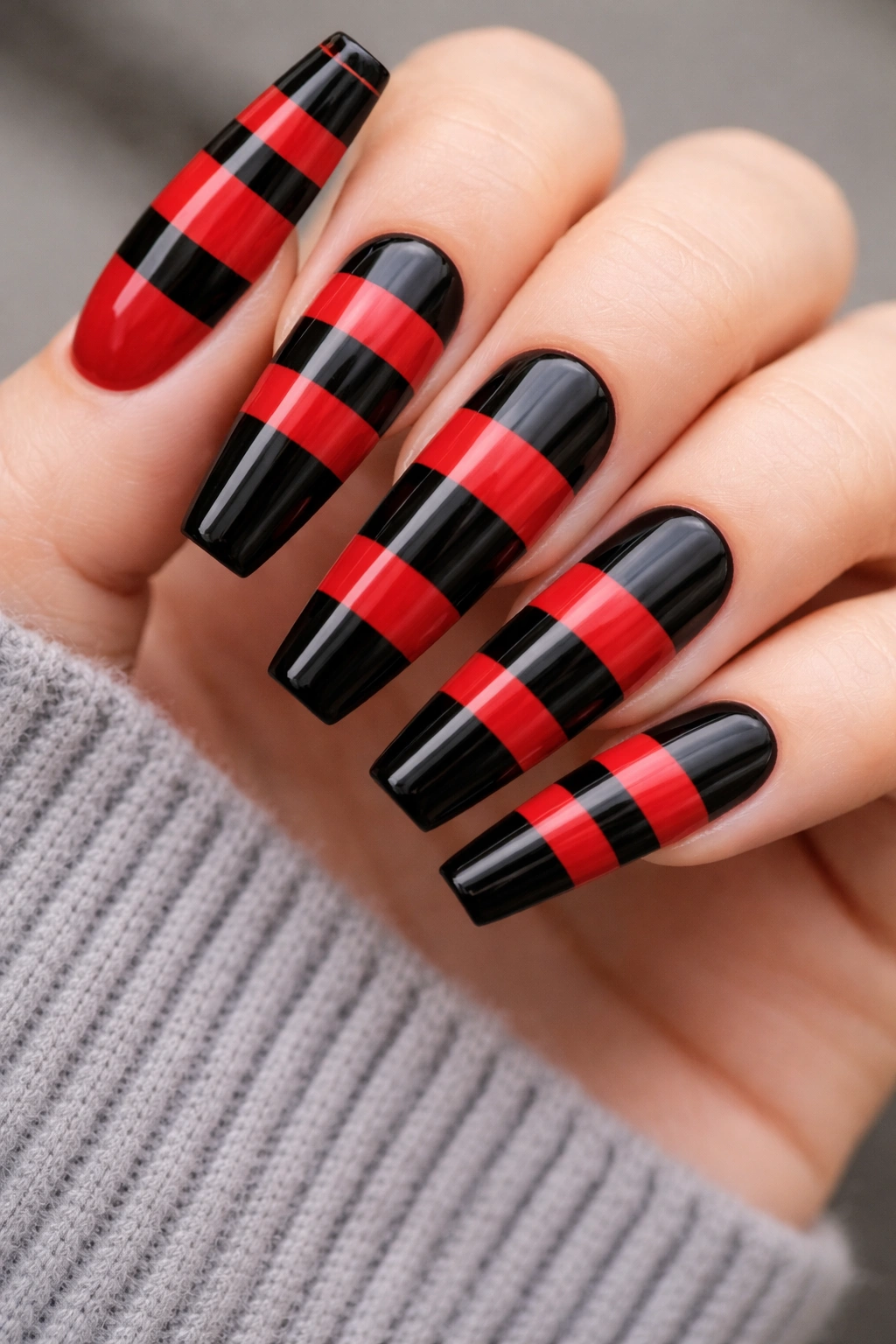 Coffin nails with alternating red and black horizontal stripes