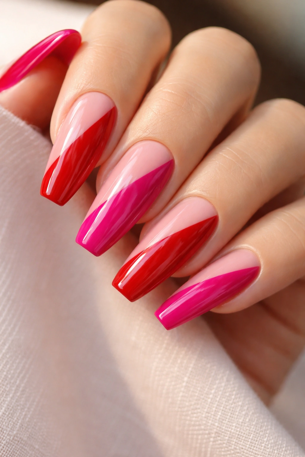Cherry red and fuchsia diagonal split nails on ballerina shape