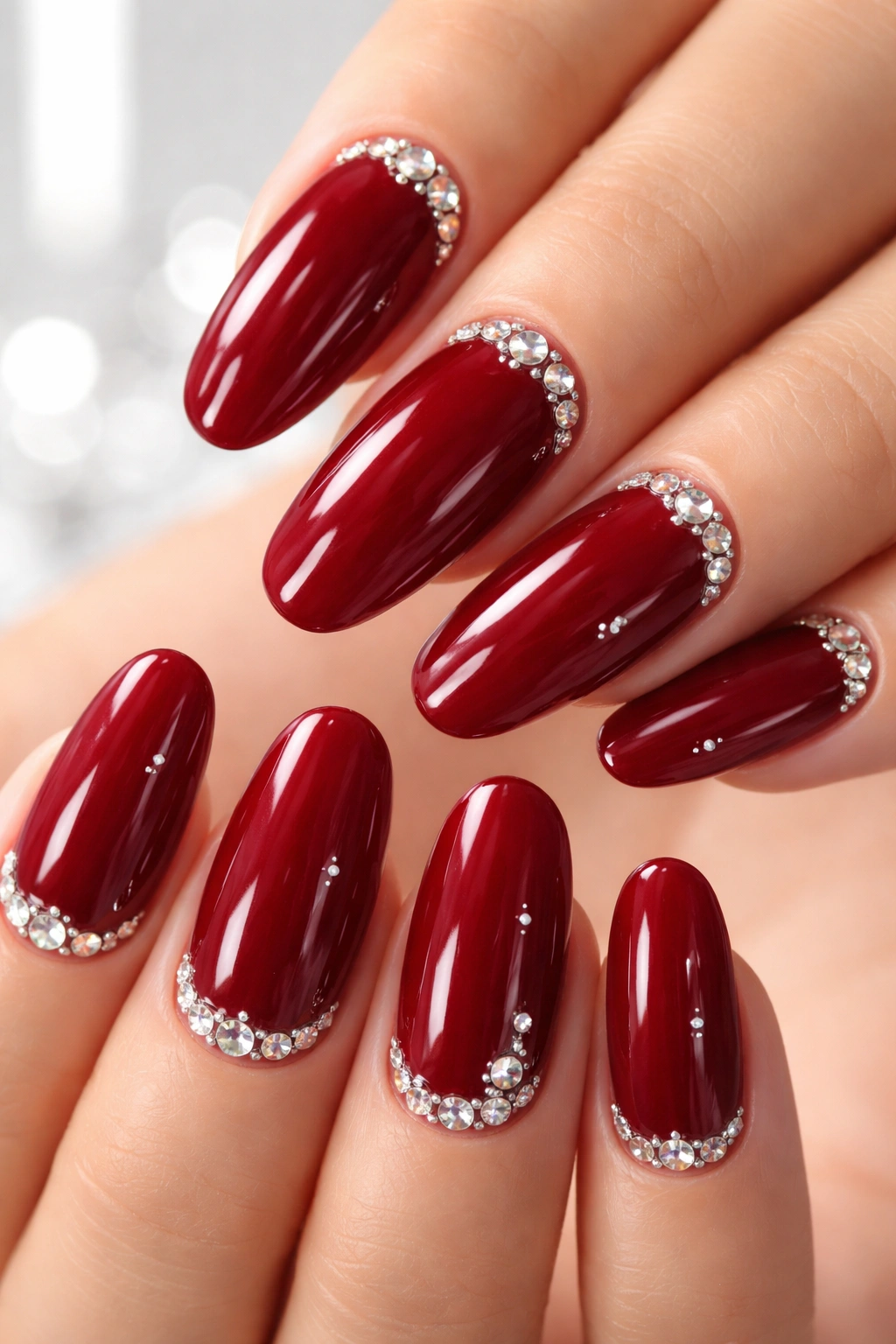 Long red nails with gloss and crystal accents