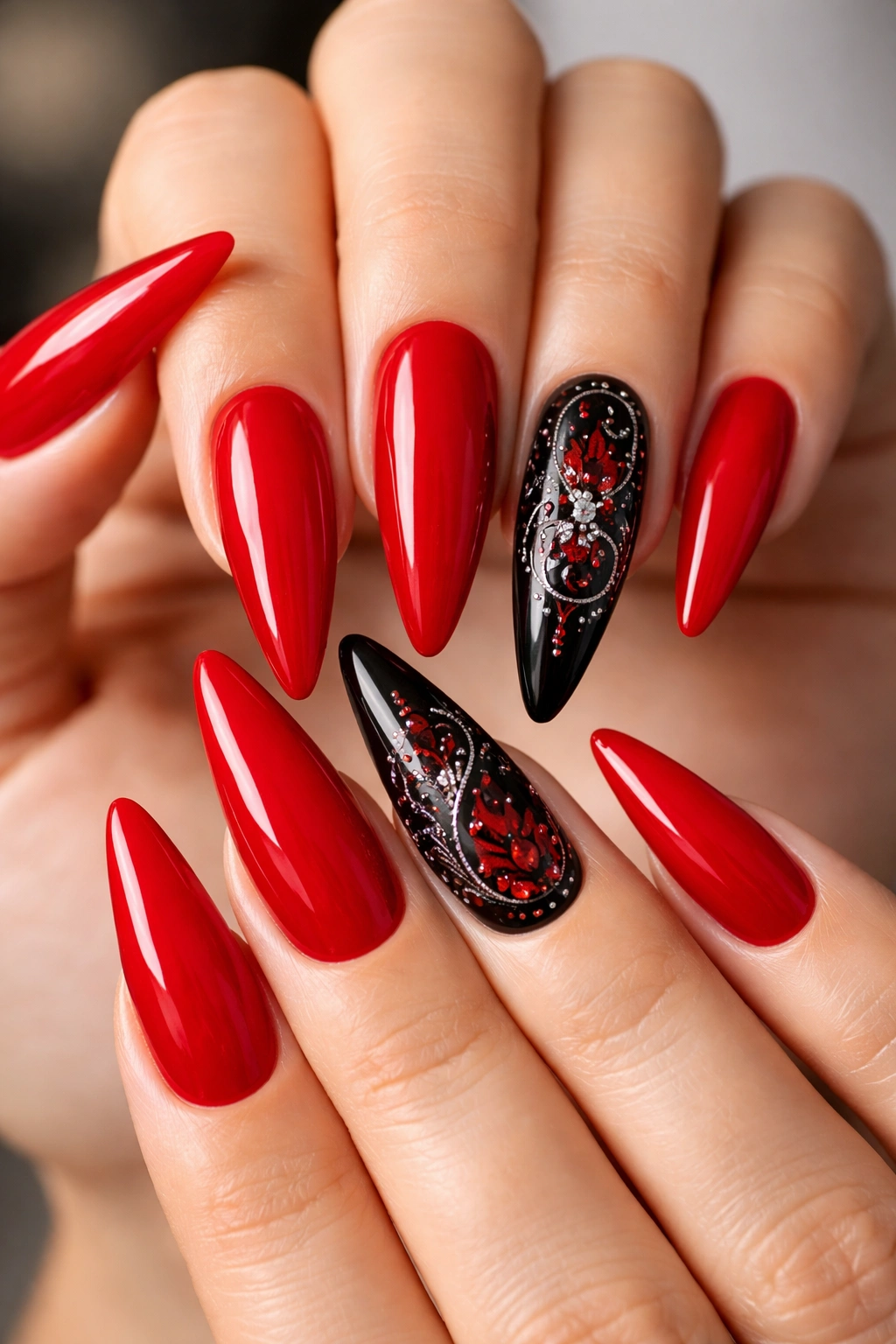 Red nails with one black accent nail featuring a full design