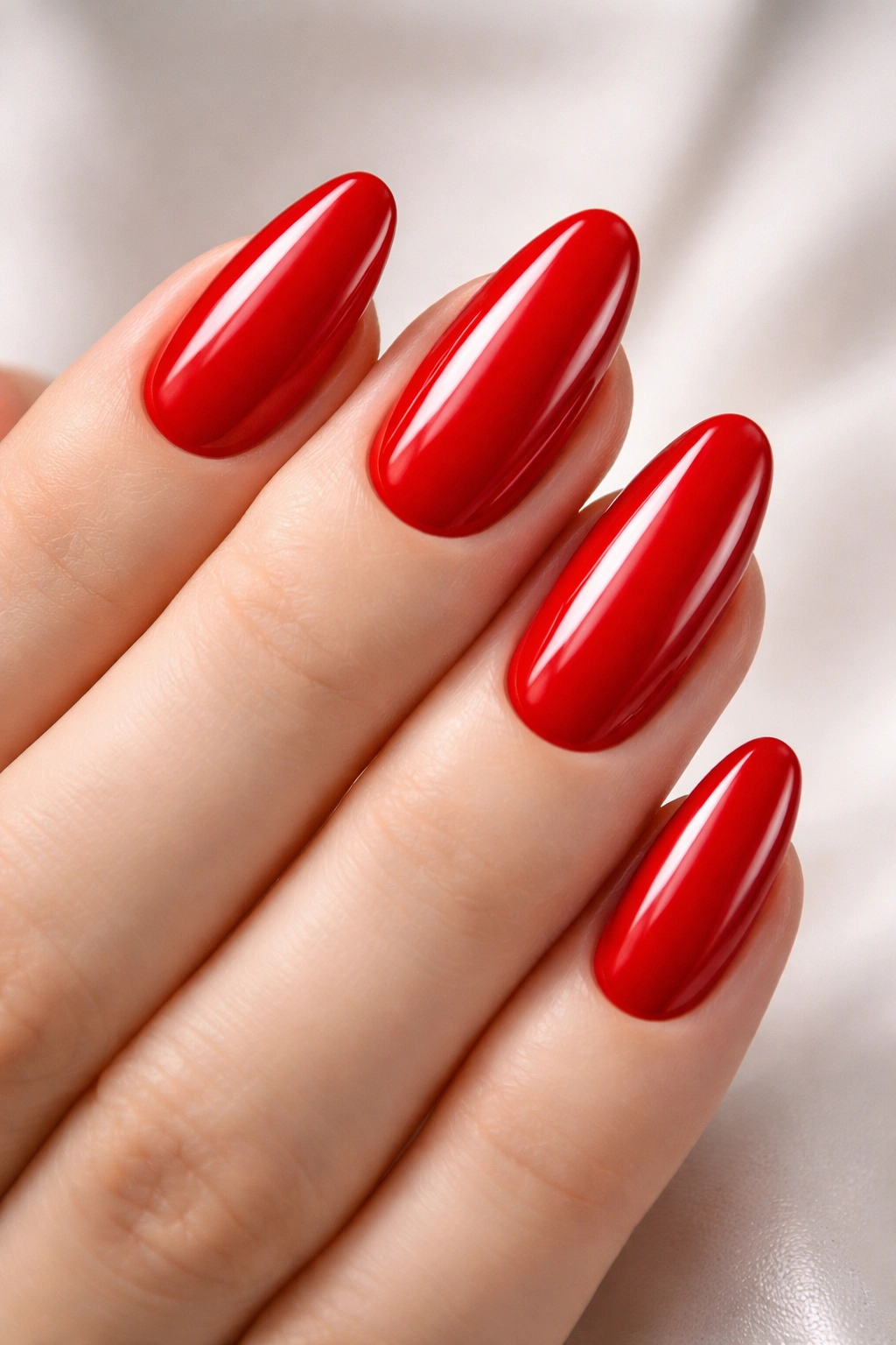 Close-up of glossy true red nails