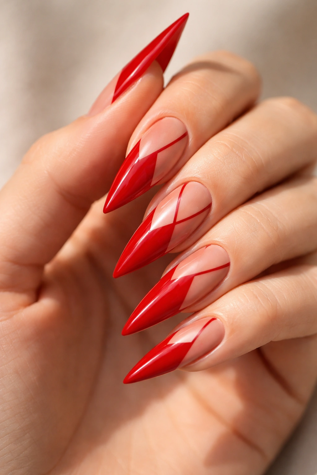 Close-up classic red nails with negative space design on stiletto nails