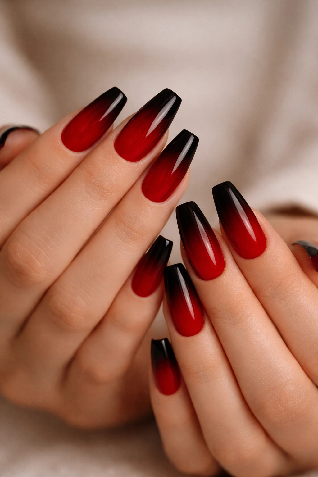 Close-up of medium coffin nails red to black ombre