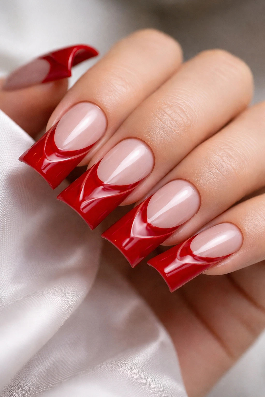 Red tips with negative space designs on nails