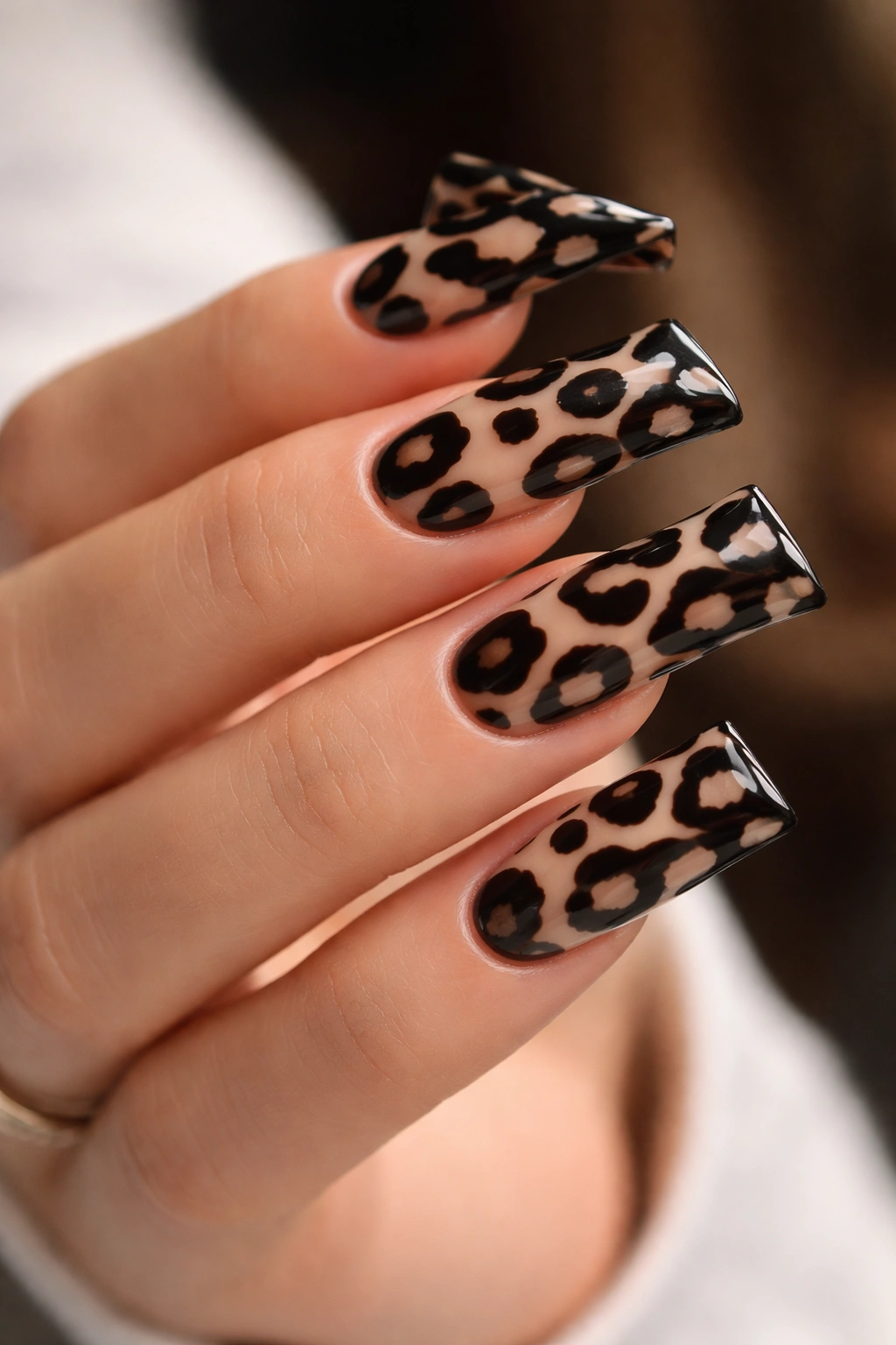 Dark-based duck nails with light reverse cheetah spots